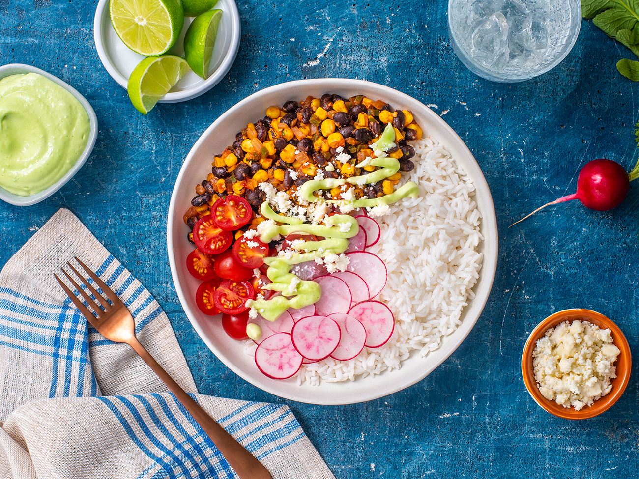 Sautéed Corn with Black Beans Bowl and Avocado Crema