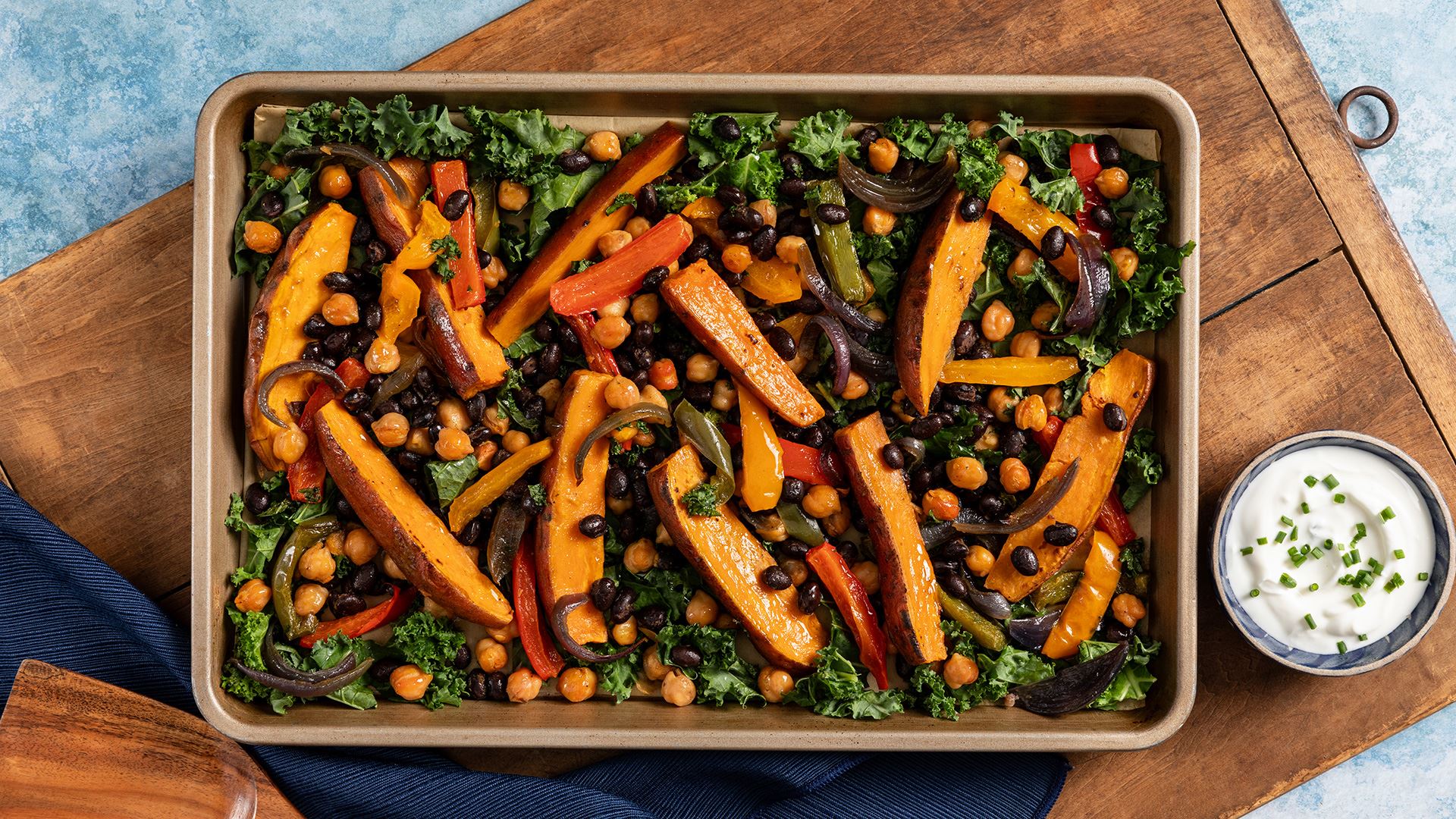 Sheet-Pan Loaded Sweet Potatoes with Spicy Beans